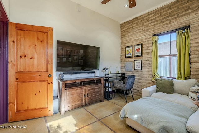 living room with ceiling fan and light tile patterned floors