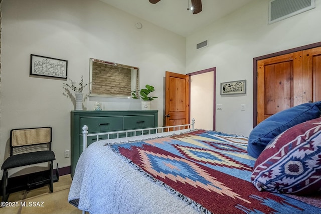 carpeted bedroom featuring ceiling fan and high vaulted ceiling