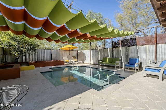 view of swimming pool with an outdoor living space and a patio