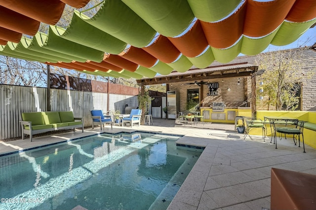 view of pool featuring an outdoor hangout area, ceiling fan, exterior kitchen, grilling area, and a patio area