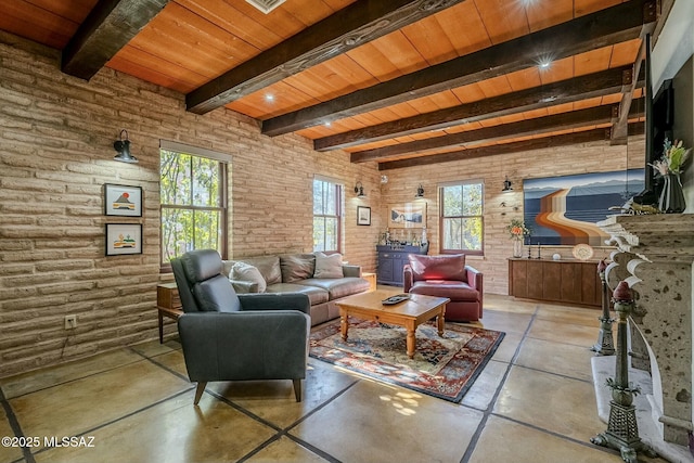 living room featuring beamed ceiling, wooden ceiling, and brick wall