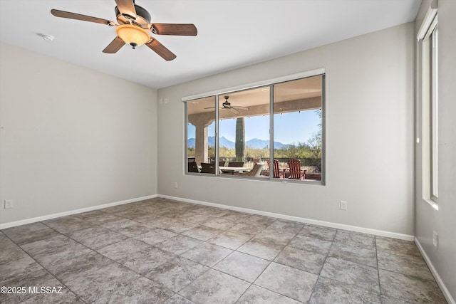 unfurnished room with a mountain view