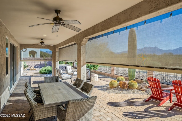 view of patio / terrace featuring ceiling fan