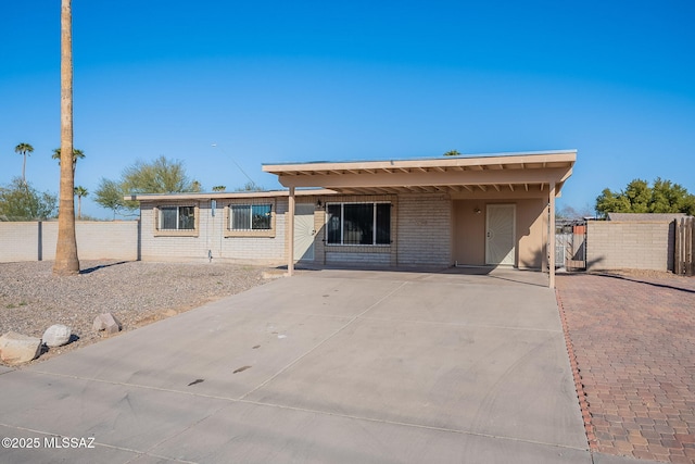 view of front of home with a carport