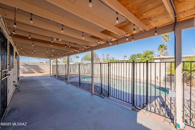 view of patio / terrace featuring a fenced in pool