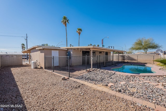 back of house with a patio area and a fenced in pool