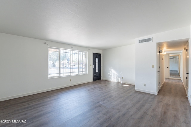 unfurnished room with hardwood / wood-style flooring