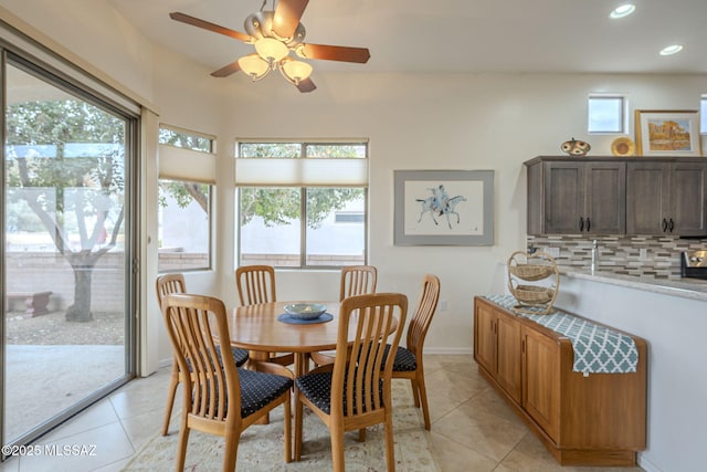 dining space featuring light tile patterned floors and a wealth of natural light