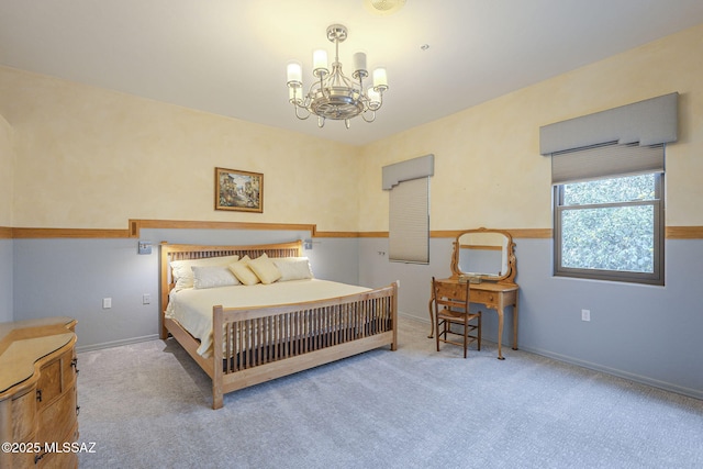 carpeted bedroom with a chandelier