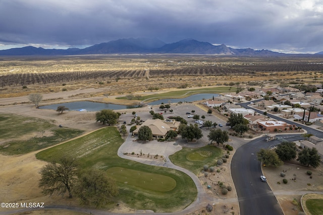 drone / aerial view with a water and mountain view