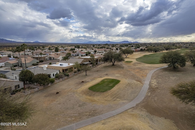 birds eye view of property with a mountain view