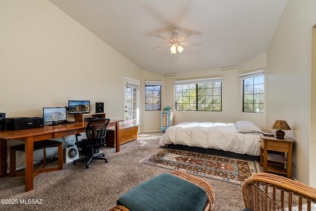 carpeted bedroom with ceiling fan and vaulted ceiling