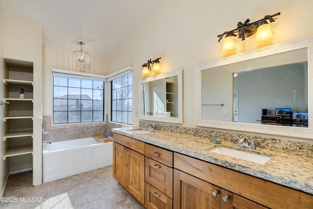 bathroom with vaulted ceiling, vanity, a bathing tub, and tile patterned flooring