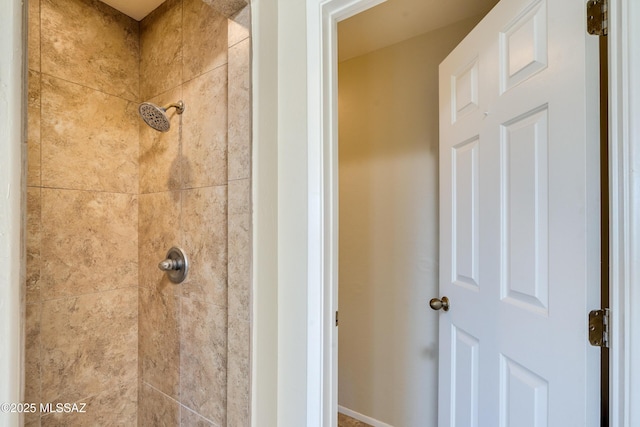 bathroom featuring tiled shower