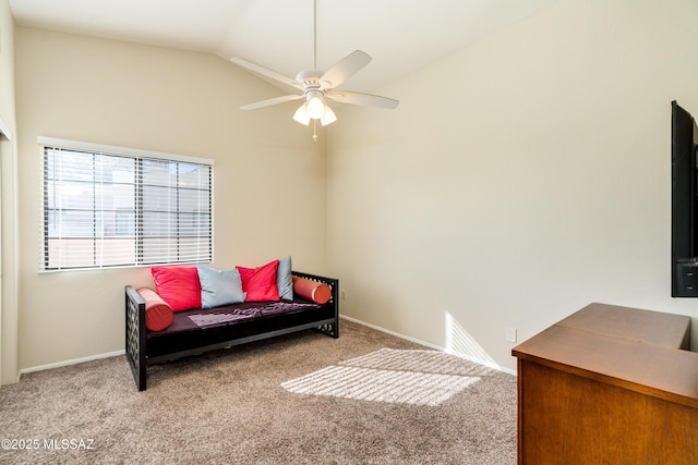 sitting room with lofted ceiling, light colored carpet, and ceiling fan