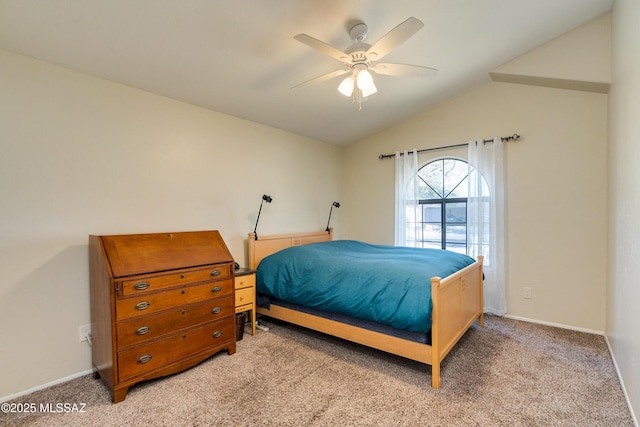 carpeted bedroom with vaulted ceiling and ceiling fan