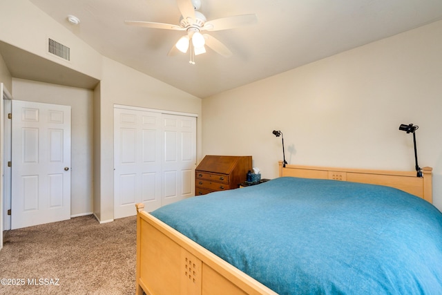 carpeted bedroom featuring lofted ceiling, ceiling fan, and a closet