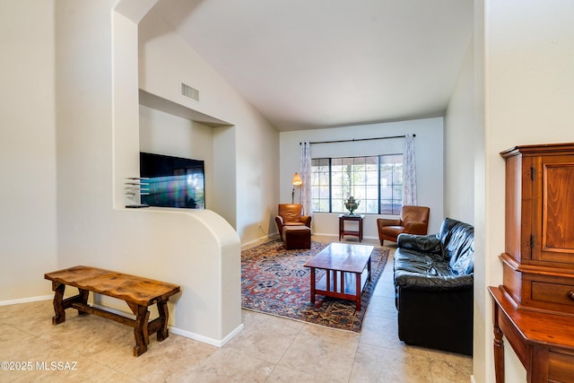 tiled living room featuring lofted ceiling