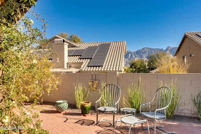 view of patio / terrace with a mountain view