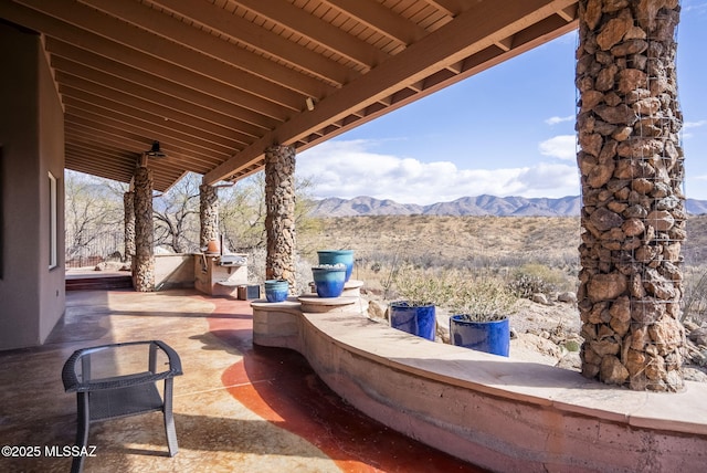 view of patio / terrace featuring a mountain view