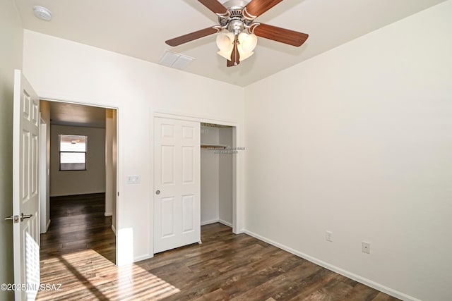 unfurnished bedroom with a closet, ceiling fan, and dark hardwood / wood-style floors