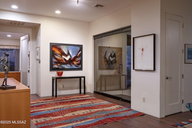 hall with dark hardwood / wood-style floors