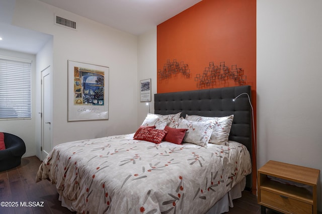 bedroom with hardwood / wood-style floors