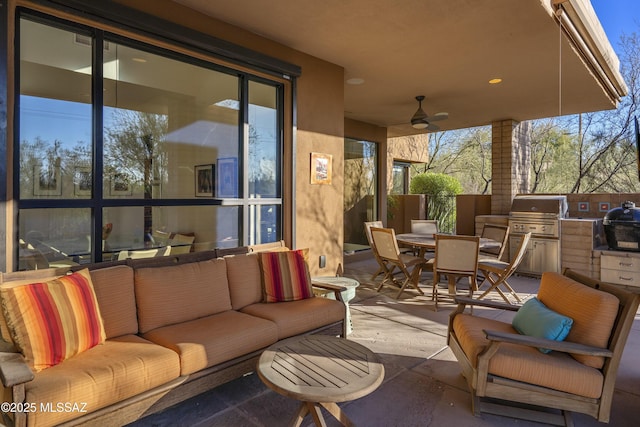 view of patio / terrace with ceiling fan, area for grilling, an outdoor hangout area, and a grill