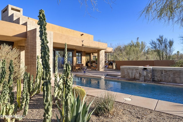 view of pool featuring a patio area