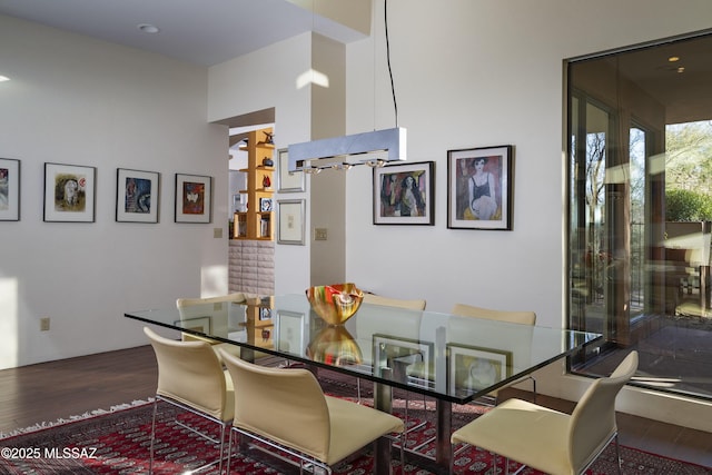 dining space with hardwood / wood-style flooring