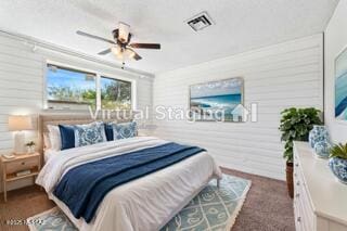 bedroom featuring a ceiling fan and visible vents