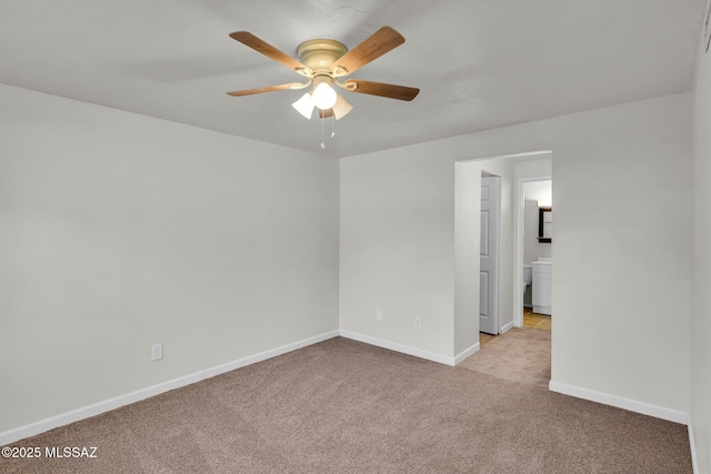 unfurnished room featuring light colored carpet and ceiling fan