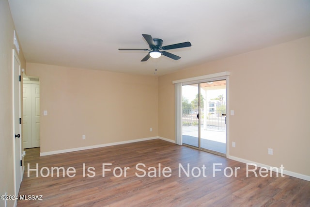 empty room featuring wood-type flooring and ceiling fan