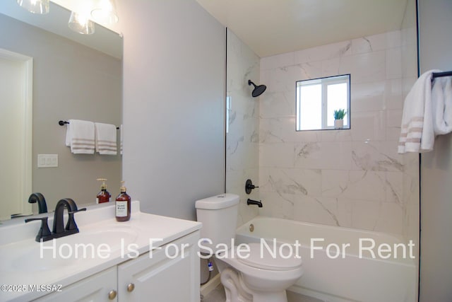 full bathroom with tiled shower / bath combo, toilet, and vanity