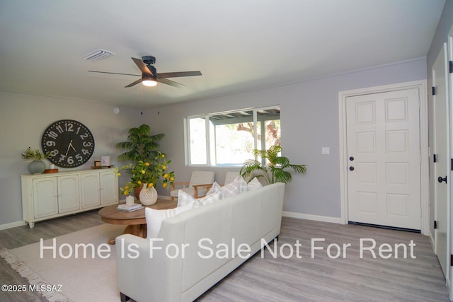 living room with ceiling fan and light wood-type flooring