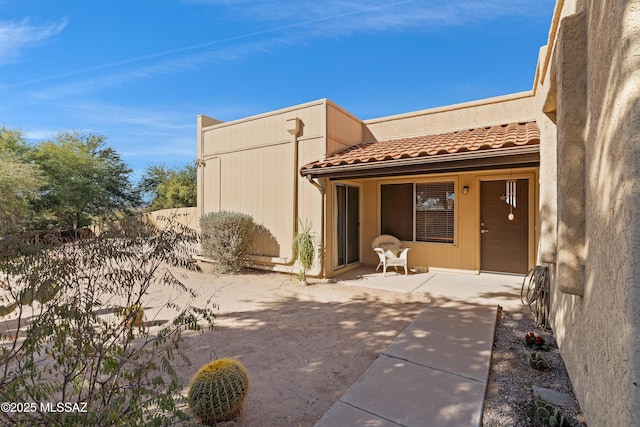 back of house with a patio