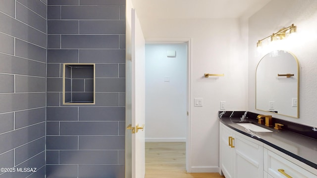 bathroom with hardwood / wood-style floors and vanity