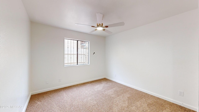 empty room with ceiling fan and carpet