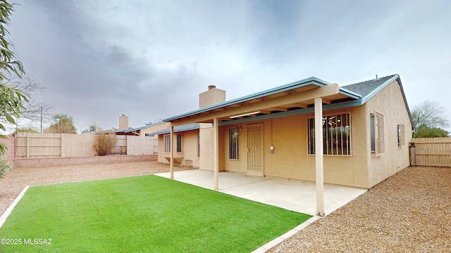 back of property featuring a patio area