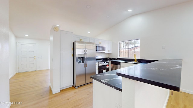 kitchen featuring kitchen peninsula, appliances with stainless steel finishes, sink, white cabinets, and light hardwood / wood-style floors