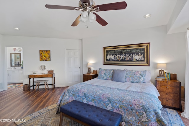 bedroom featuring ceiling fan and dark hardwood / wood-style floors