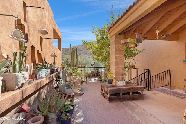 view of patio / terrace featuring a mountain view