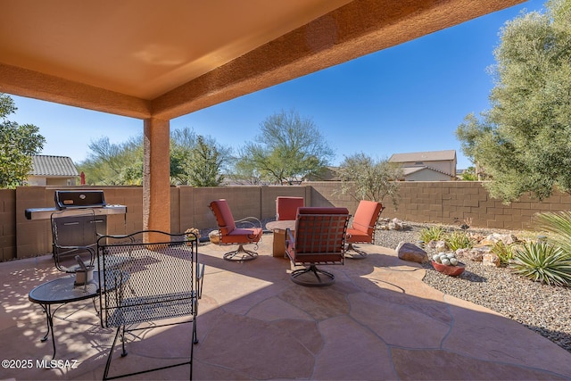 view of patio with an outdoor fire pit