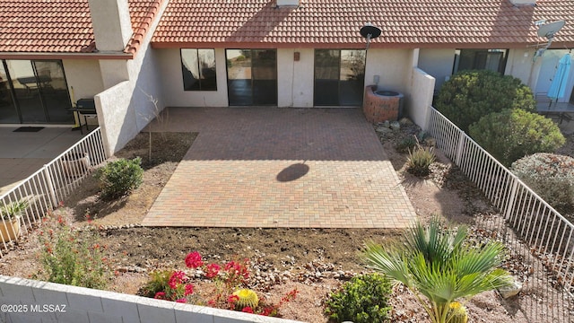 entrance to property with a patio