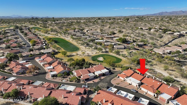 birds eye view of property with a mountain view