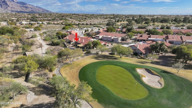 birds eye view of property with a mountain view