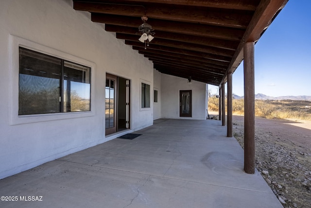 view of patio / terrace featuring a mountain view