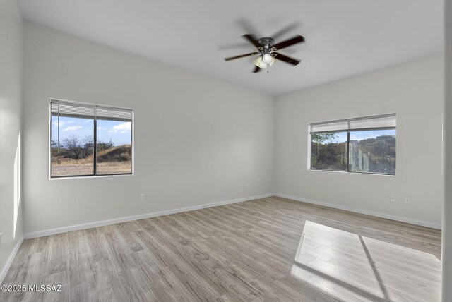 unfurnished bedroom featuring light wood-type flooring, a closet, and ceiling fan