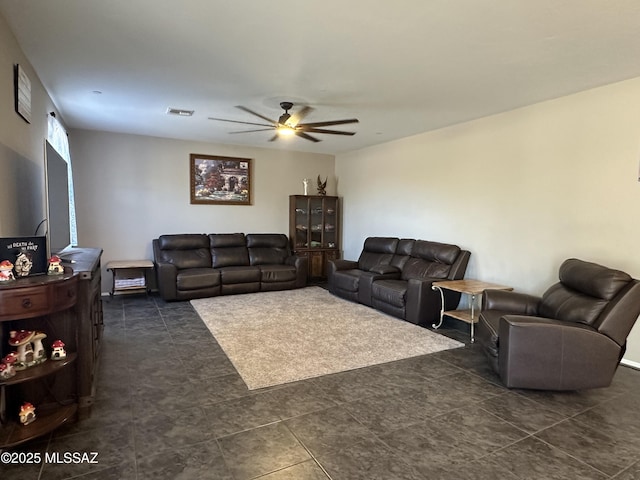 living area featuring ceiling fan and visible vents