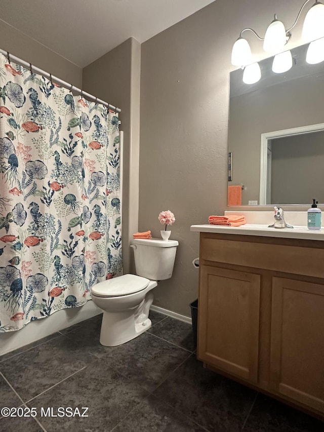 full bath with shower / tub combo, baseboards, toilet, tile patterned flooring, and vanity